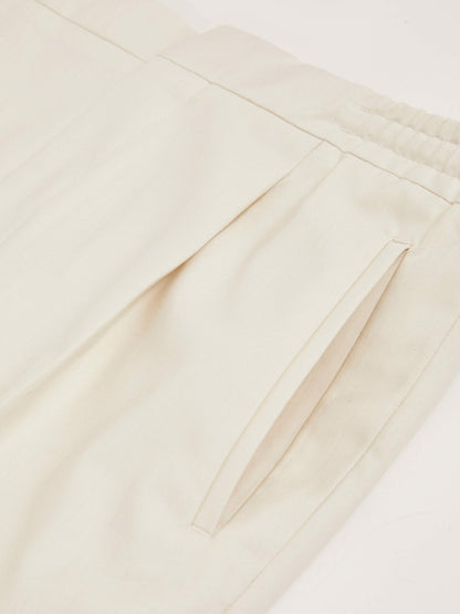 Relaxed-Fit Pleated Tapered Trousers in Ecru | Reiss Men Signature