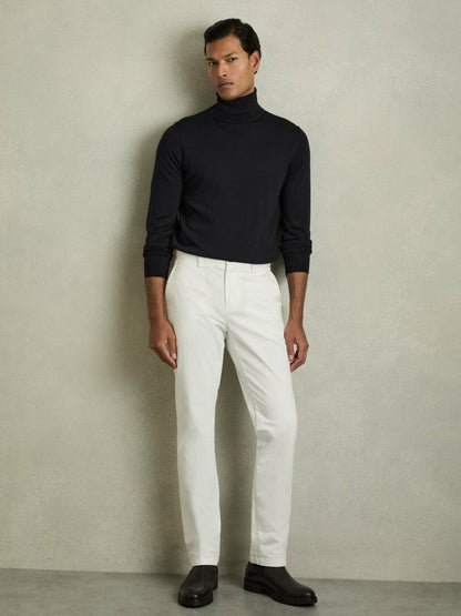 Slim Fit Merino Wool Roll Neck Jumper in Navy | Reiss Men Trending