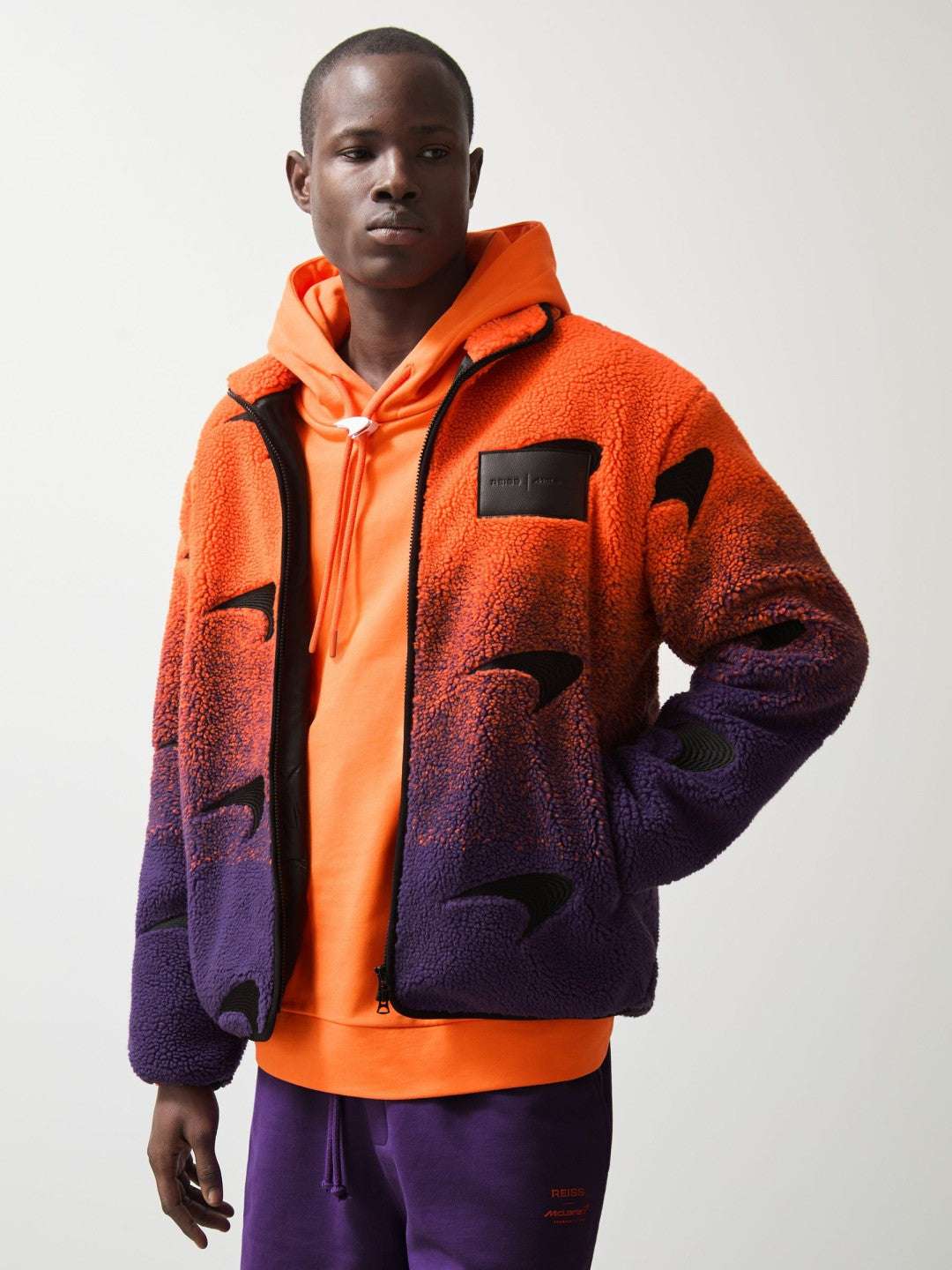 Unisex Fit McLaren F1 Team Ombré Fleece Jacket in Papaya Orange/Purple | Reiss Men New
