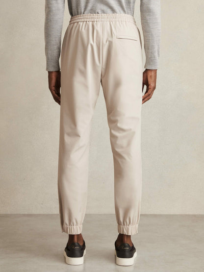 Drawstring Technical Cuffed Trousers in Stone | Reiss Men Recommended
