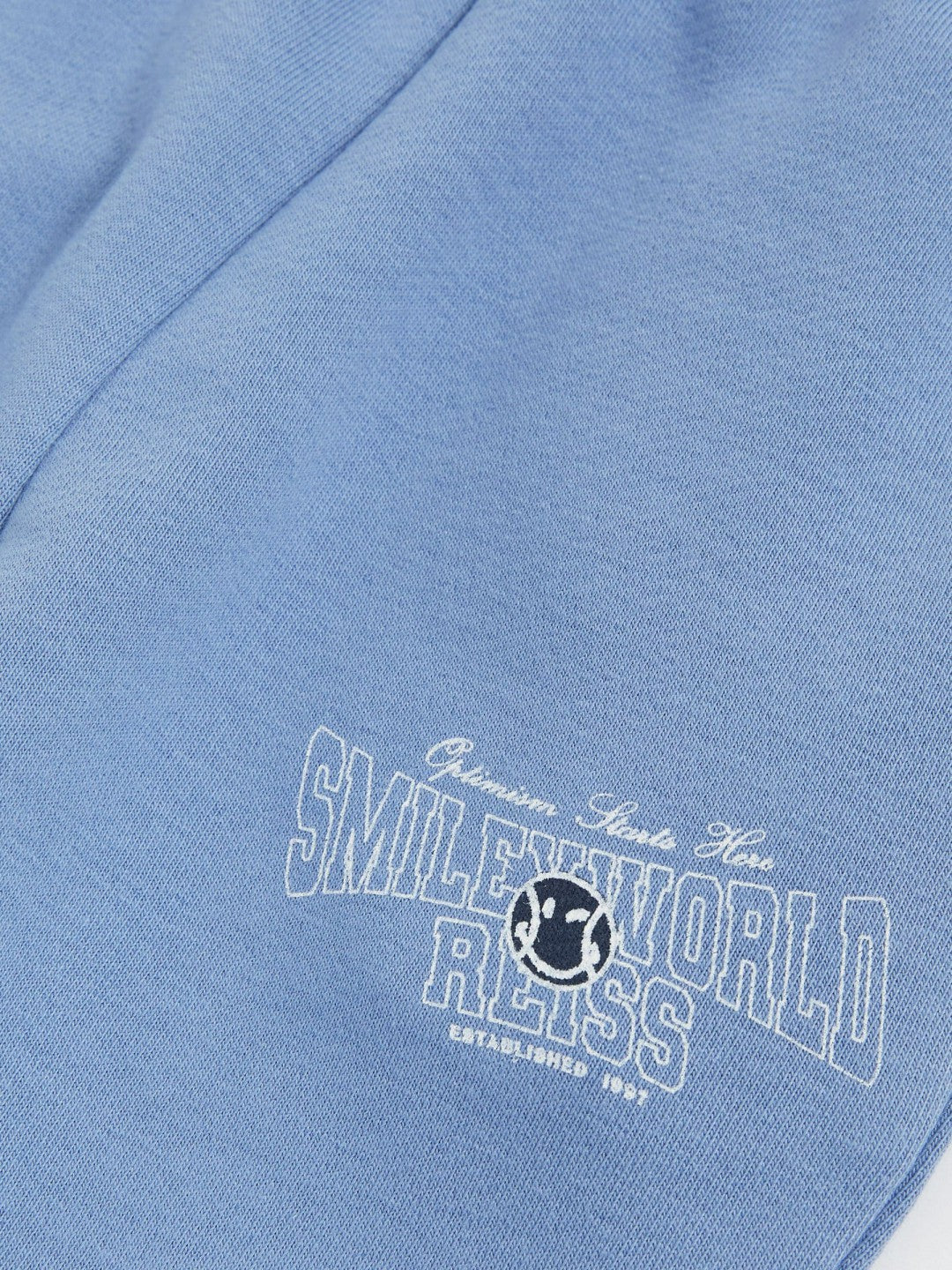 13-14 yrs SmileyWorld Cuffed Joggers Unisex Fit in Blue | Reiss Children & Baby New