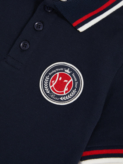 3-9 yrs SmileyWorld Piqué Polo Shirt in Navy | Reiss Children & Baby Best Seller