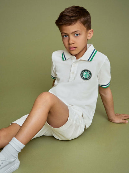 3-9 yrs SmileyWorld Piqué Polo Shirt in White | Reiss Children & Baby Exclusive