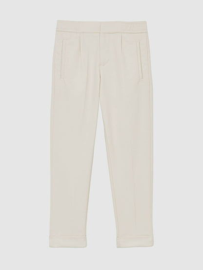 9-13 yrs Relaxed-Fit Pleated Tapered Trousers in Off White | Reiss Children & Baby Premium