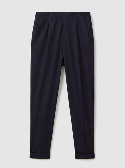 Relaxed-Fit Pleated Tapered Trousers in Navy | Reiss Men Signature