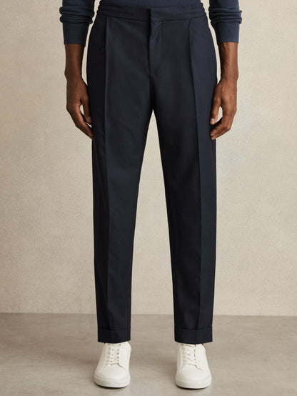 Relaxed-Fit Pleated Tapered Trousers in Navy | Reiss Men Signature